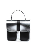 a bold silver leather top handle bag with a chocolate calf hair base, confidently styled for a contemporary woman