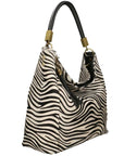 Zebra Print Calf Hair Tassel Bag – Elegant & Versatile by Sostter at brixbailey.com
