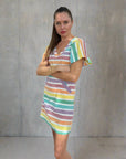 Premium lightweight cotton rainbow shift dress with A-line silhouette, puff sleeves, back zipper, and pockets by GILD at brixbailey.com