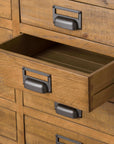 Industrial merchant chest with solid pine wood and gunmetal accents, featuring 20 storage compartments and rustic-industrial design by Sostter at brixbailey.com