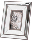 bold wood and mirror frame with dramatic lighting on a dark surface
