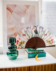 Floral Silk Fan with Toucan design and luxurious Gold tassel, part of the Mysa Collection