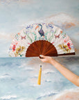 Floral Silk Fan with Toucan design and luxurious Gold tassel, part of the Mysa Collection