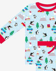 Premium Christmas pajama set for couples, cozy organic cotton sleepwear with penguin and snowman print, stylish matching holiday loungewear by Toby Tiger at brixbailey.com