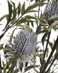 Artificial blue thistle stem with powder-blue petals, hyper-realistic design, perfect for rustic or coastal decor. by sostter at brixbailey.com