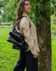 Black Leather Handbag with Metallic Accents, Crossbody