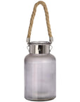 Frosted grey glass lantern with rope handle and warm LED glow, creating a starlight effect for indoor or outdoor decor. by RoomLondon at brixbailey.com