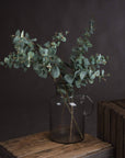 Lifelike variegated faux eucalyptus stem in sage green, handcrafted with realistic texture for home decor. by sostter at brixbailey.com