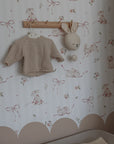 bold close-up of charming pink rabbits on stripes wallpaper for a kids room