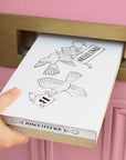 Biscuiteers x Olivia Rubin Rainbow Croissant Letterbox Biscuit