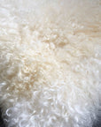 British white curly square sheepskin seat pads, premium natural ivory cream sheepskin, luxury handcrafted home decor, stylish rustic chair cover, best-selling cozy seat cushion by Wildash London at brixbailey.com