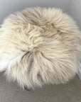 Premium 35cm round sheepskin seat pad, luxury British rare breed natural melange, handcrafted sustainable comfort, stylish home decor by Wildash London at brixbailey.com