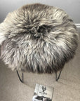 Premium 35cm round sheepskin seat pad, luxury British rare breed, natural melange, sustainable handcrafted comfort, stylish home decor by Wildash London at brixbailey.com