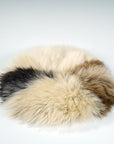 Premium 35cm round sheepskin seat pad, luxury British rare breed natural melange, handcrafted sustainable comfort, soft insulating breathable by Wildash London at brixbailey.com