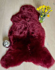 Premium British sheepskin rug, luxury Bordeaux red fleece throw, large ethically sourced handcrafted sheepskin, soft hypoallergenic organic fur by Wildash London at brixbailey.com
