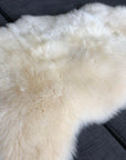 Luxury premium sheepskin rug, full hide with super soft long white fur, natural ivory tone, handcrafted best-selling medium throw by Wildash London at brixbailey.com