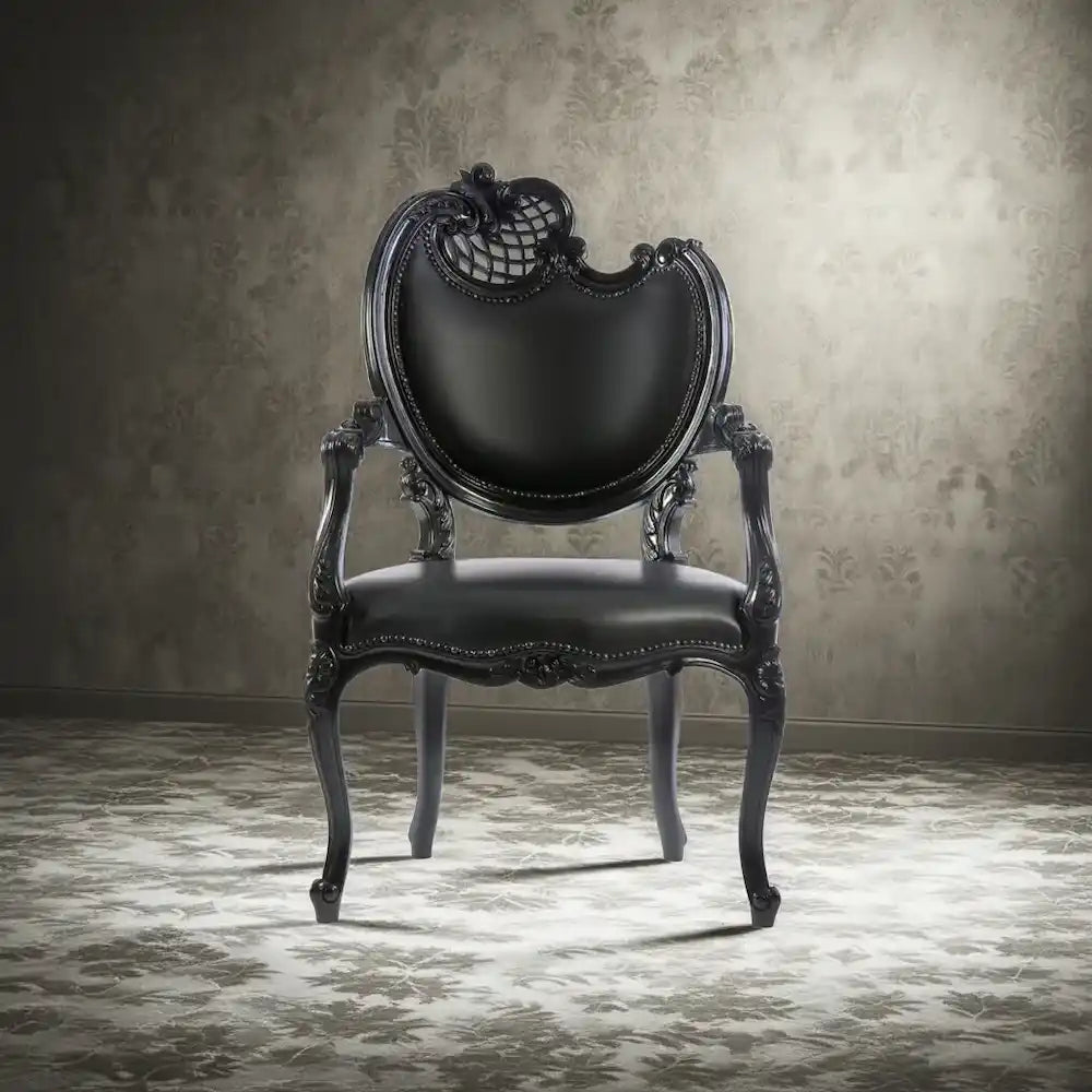 Statement black chair with intricate skull motif upholstery beside a yellow editorial panel promoting indie home décor from Brix + Bailey.