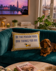 Shop cushions at Brix + Bailey, a dachshund on a teal velvet sofa beside a slogan cushion