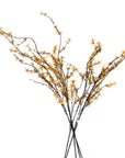 an elegant yellow forsythia stem in a minimalist vase against a soft grey backdrop