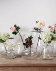 Clear glass Hydria vase with tapered neck and rounded base, perfect for floral arrangements or standalone decor. by RoomLondon at brixbailey.com