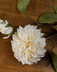 White artificial dahlia stem with lifelike layered petals, pure white color, and realistic texture, 62 cm tall. by sostter at brixbailey.com