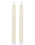 Elegant ivory LED dinner candle with warm flickering glow, flameless and smokeless, 25cm tall for stylish table decor by RoomLondon at brixbailey.com