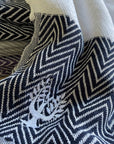 Luxury handloomed organic cotton chevron throw, navy blue, oversized 200x250cm, premium heavyweight, soft texture, stylish zigzag pattern by Wildash London at brixbailey.com
