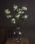 Realistic white mock orange blossom spray with delicate petals and leaves, perfect for home decor by sostter at brixbailey.com
