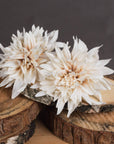 Cream artificial dahlia flower with warm orange tones, lifelike petals, and neutral café au lait hues for home decor. by RoomLondon at brixbailey.com