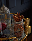 Handcrafted Moroccan lidded jar with hammered metal detailing and glass body, perfect for jewelry or spice storage. by Sostter at brixbailey.com