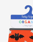 Premium organic baby bandana bib, 100% GOTS-certified cotton, soft absorbent fabric, adjustable snap closure, stylish bat print, eco-friendly dyes by Toby Tiger at brixbailey.com