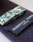 navy and red pin spot design tie