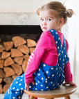 Premium organic cotton polka dot pinafore overall, soft blue with white dots and pink button accents, adjustable straps for growing kids by Toby Tiger at brixbailey.com