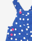 Premium organic cotton pinafore overall in blue with white polka dots, stylish and comfortable, adjustable straps for growing kids, soft jersey lining by Toby Tiger at brixbailey.com