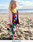 Premium Toby Tiger kids denim overall with multicolor heart print, adjustable straps, snap buttons, soft organic cotton, stylish blue pinafore for toddlers by Toby Tiger at brixbailey.com