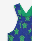 Premium green and blue turtle print pinafore overalls, adjustable straps, snap buttons, soft GOTS certified organic cotton, stylish kids summer wear by Toby Tiger at brixbailey.com