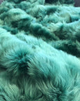 Premium Emerald Green Tuscan Shearling Throw, luxury handcrafted sheepskin rug, stylish deep green Toscana shearling, best-selling home decor by Wildash London at brixbailey.com