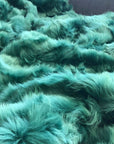 Emerald Green Tuscan Shearling Throw, premium luxury handcrafted sheepskin rug, elegant emerald green home decor, sustainable stylish accent piece by Wildash London at brixbailey.com
