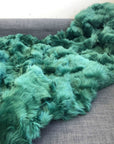 Premium Emerald Green Tuscan Shearling Throw, luxury handcrafted sheepskin rug, stylish sustainable home decor, best-selling soft shearling by Wildash London at brixbailey.com