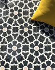 Luxury black cement floor tile, elegant white floral pattern, premium hexagon kitchen and bathroom tiles, best-selling UK delivery by Maria Starling Design at brixbailey.com