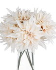 Cream artificial dahlia flower with warm orange tones, lifelike petals, and neutral café au lait hues for modern home decor. by RoomLondon at brixbailey.com