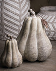 Handcrafted wood-effect resin pumpkin with whitewashed finish, bronze leaf accents, and wooden stalk for autumn decor by RoomLondon at brixbailey.com