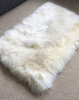 Premium British sheepskin rug, luxury ivory white fur throw, soft plush rectangular 55cm x 85cm, handcrafted sustainable free-range wool by Wildash London at brixbailey.com