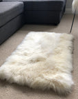 Premium British sheepskin rug, luxury ivory white fur throw, soft plush blanket, 55cm x 85cm, handcrafted sustainable sheepskin by Wildash London at brixbailey.com