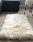 Premium British sheepskin rug, luxury white fur throw, soft plush ivory cream, handcrafted straight edges, 55cm x 85cm by Wildash London at brixbailey.com