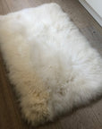 Premium British Sheepskin Rug, Luxurious Soft White Fur Throw, Handcrafted Ivory Cream Rectangular 55cm x 85cm by Wildash London at brixbailey.com