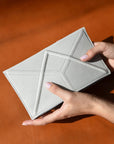 Luxurious Facet Clutch by Gerda Retter – Handcrafted Leather Elegance by Gerda Retter Design at www.brixbailey.com