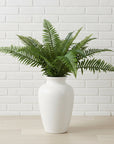 Lifelike artificial fern bunch with cascading foliage, true forest green color, and UV-resistant materials for lasting vibrancy. by sostter at brixbailey.com