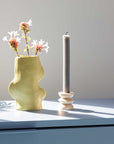 bold pistachio ceramic vase in dramatic studio light showcasing its unique handmade texture