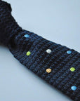 navy blue skinny knitted tie with multicoloured polka dots